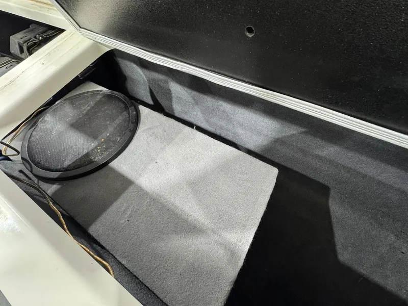 Slide: The Image of Storage compartment with speaker in 2016 MasterCraft NXT22 boat. - 16