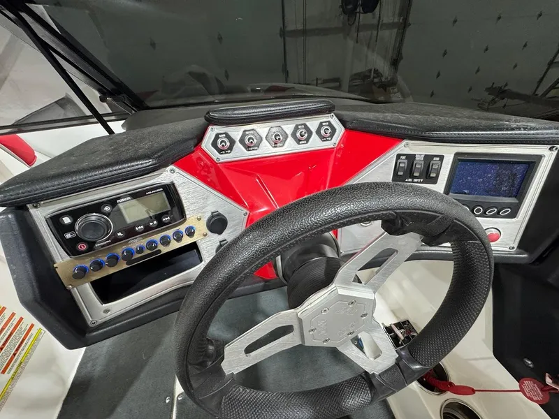 Slide: The Image of 2016 MasterCraft NXT22 dashboard with steering wheel, controls, and display panel. - 17