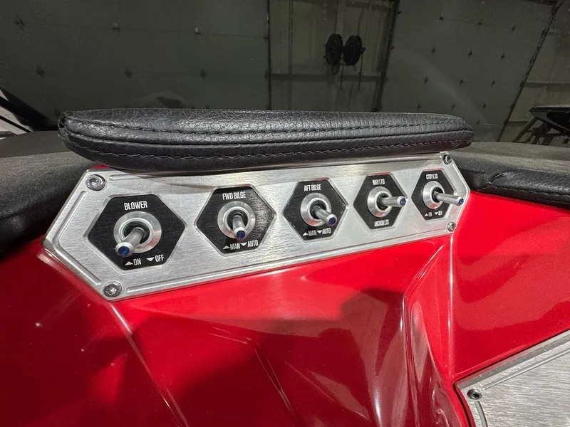 Slide: The Image of Control panel of a 2016 MasterCraft NXT22 boat with various switches. - 18