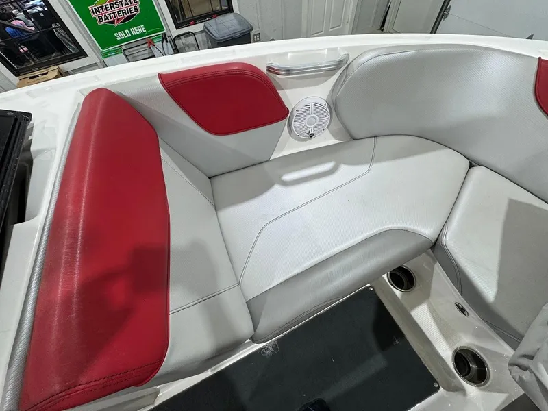 Slide: The Image of 2016 MasterCraft NXT22 boat interior with red and white seating. - 20