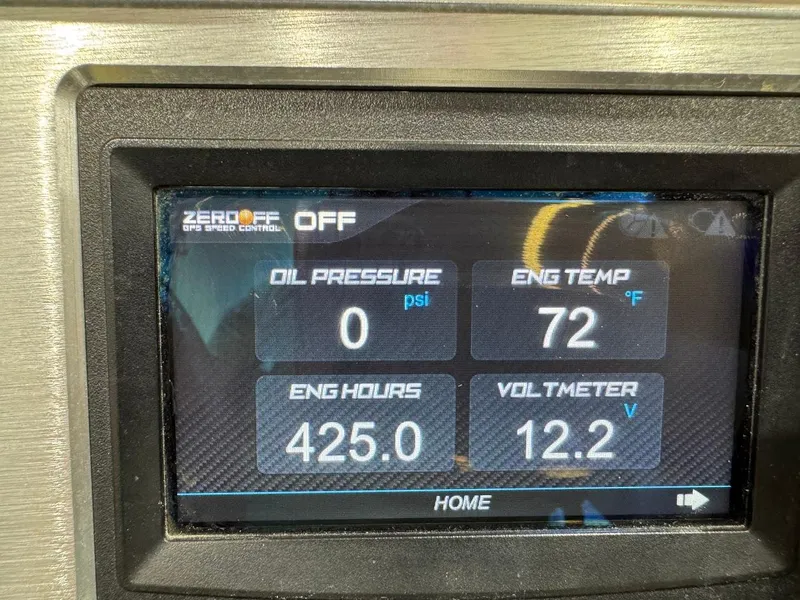 Slide: The Image of Dashboard display of a 2016 MasterCraft NXT22 showing engine metrics and settings. - 24