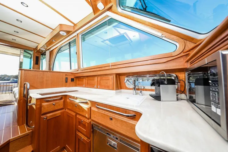 Slide: The Image of Luxurious interior of 2025 Sabre 45 Salon Express yacht with modern kitchen amenities. - 4