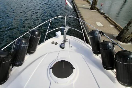 Slide: The Image of Bow view of 2006 Meridian 341 Sedan yacht docked at marina. - 13