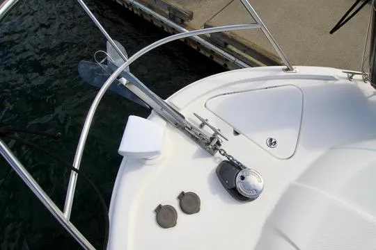 Slide: The Image of 2006 Meridian 341 Sedan boat deck with anchor and railing at dockside. - 14