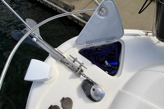 Slide: The Image of 2006 Meridian 341 Sedan boat anchor system with open storage compartment. - 15