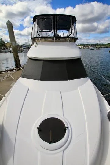 Slide: The Image of 2006 Meridian 341 Sedan yacht docked at marina under cloudy sky. - 16