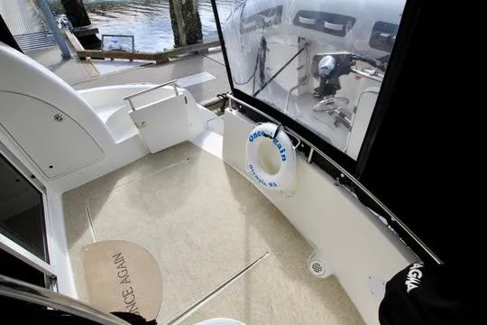 Slide: The Image of 2006 Meridian 341 Sedan boat interior with seating and life preserver. - 18