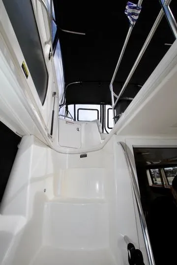 Slide: The Image of 2006 Meridian 341 Sedan yacht interior stairs with sleek design and modern features. - 20