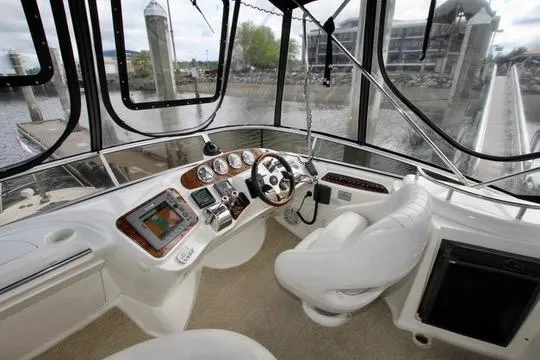 Slide: The Image of 2006 Meridian 341 Sedan helm with modern controls and panoramic windows. - 24