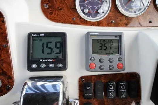 Slide: The Image of Control panel of a 2006 Meridian 341 Sedan boat with depth and navigation displays. - 27
