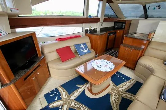 Slide: The Image of Luxurious interior of 2006 Meridian 341 Sedan yacht with cozy seating and nautical decor. - 36