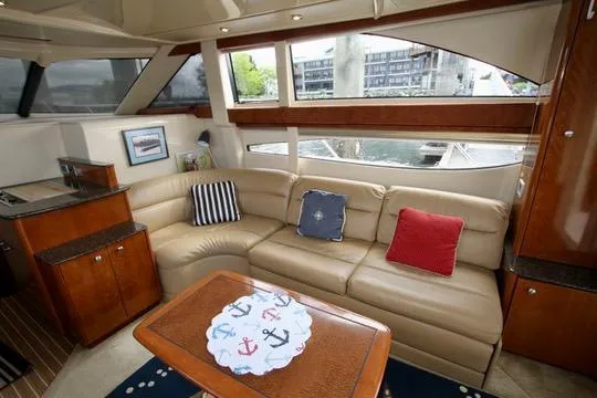 Slide: The Image of Luxurious 2006 Meridian 341 Sedan yacht interior with beige leather seating and nautical decor. - 37