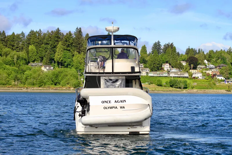 Slide: The Image of 2006 Meridian 341 Sedan boat on water, labeled "Once Again," Olympia, WA. - 4