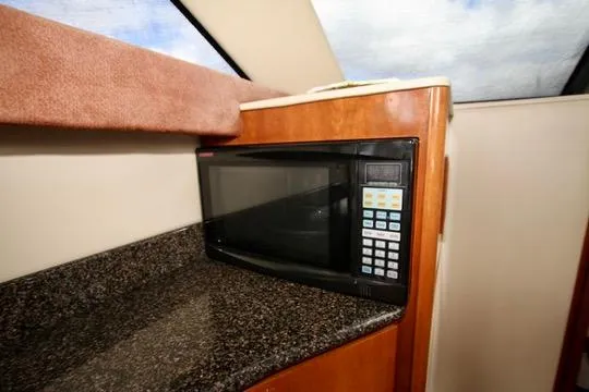Slide: The Image of Microwave in 2006 Meridian 341 Sedan yacht kitchen with granite countertop. - 45