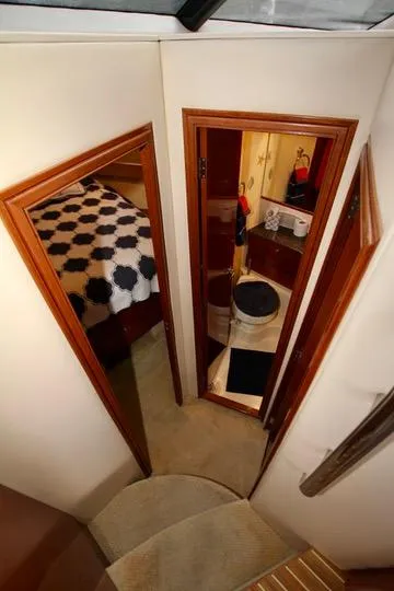 Slide: The Image of Interior view of 2006 Meridian 341 Sedan yacht, featuring bedroom and bathroom. - 49