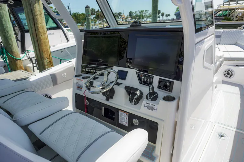 Slide: The Image of 2026 Sea Fox 368 Commander boat cockpit with modern navigation equipment and luxurious seating. - 13