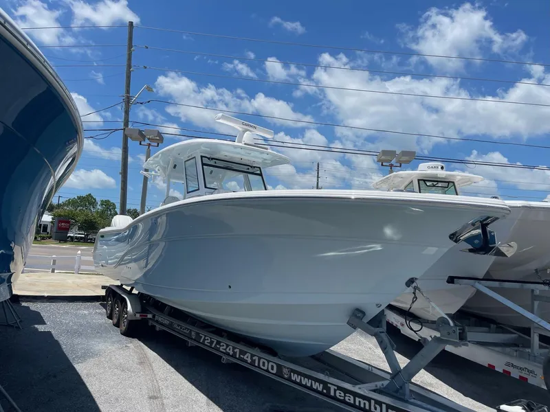 Slide: The Image of 2026 Sea Fox 368 Commander boat on trailer under blue sky. - 20