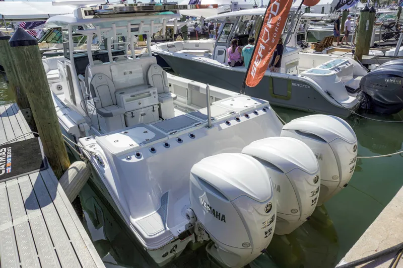 Slide: The Image of 2026 Sea Fox 368 Commander boat with triple Yamaha engines docked at marina. - 7