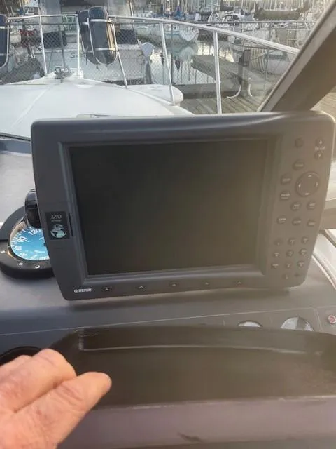 Slide: The Image of 1990 Tiara Yachts 3100 Open dashboard with navigation equipment and controls. - 18