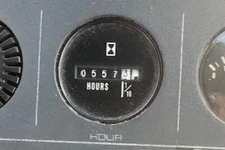 Slide: The Image of Hour meter showing 557.3 hours on a 1990 Tiara Yachts 3100 Open. - 20