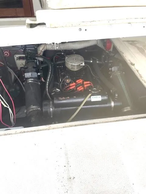 Slide: The Image of Engine compartment of a 1990 Tiara Yachts 3100 Open, showcasing mechanical components. - 27