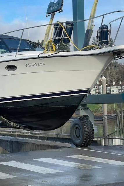 Slide: The Image of 1990 Tiara Yachts 3100 Open on lift, showcasing sleek design and sturdy build. - 3