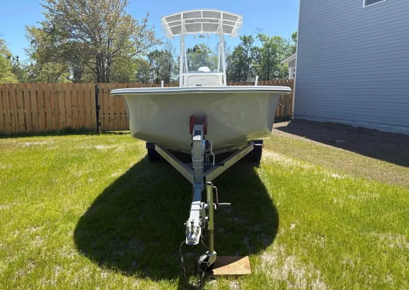 Slide: The Image of 2021 Savannah SS21 boat on trailer in grassy yard. - 1