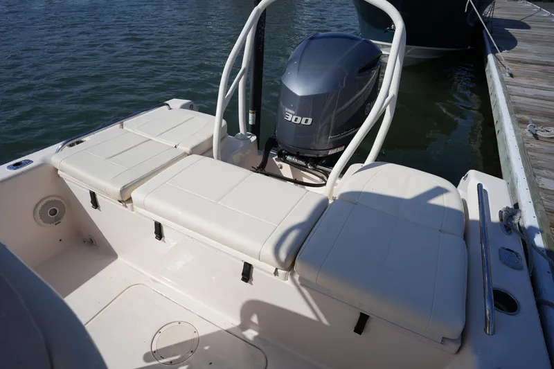 Slide: The Image of 2016 Grady-White 251 Coastal Explorer boat with Yamaha 300 engine, docked by the water. - 13