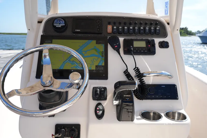 Slide: The Image of Control panel of 2016 Grady-White 251 Coastal Explorer boat with navigation equipment. - 18