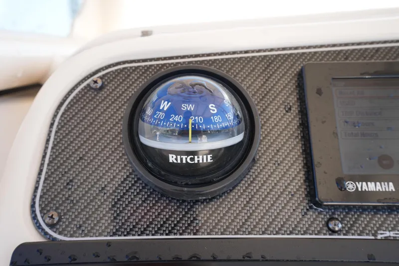 Slide: The Image of Compass on 2016 Grady-White 251 Coastal Explorer dashboard, featuring Ritchie and Yamaha components. - 20