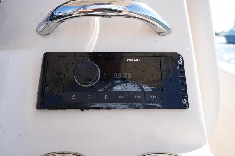Slide: The Image of Boat stereo system on 2016 Grady-White 251 Coastal Explorer, featuring Fusion audio controls. - 24
