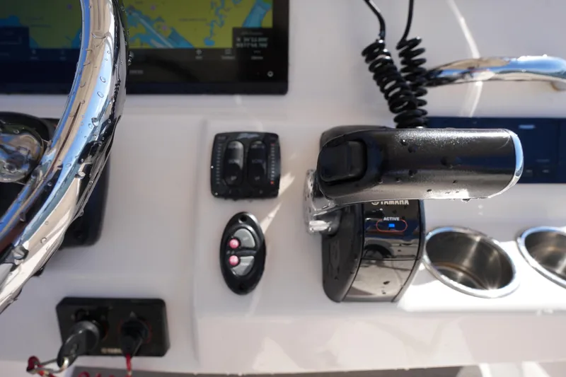 Slide: The Image of Control panel of 2016 Grady-White 251 Coastal Explorer boat with steering wheel and throttle. - 25