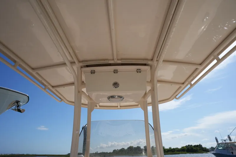 Slide: The Image of 2016 Grady-White 251 Coastal Explorer boat canopy with clear sky background. - 27