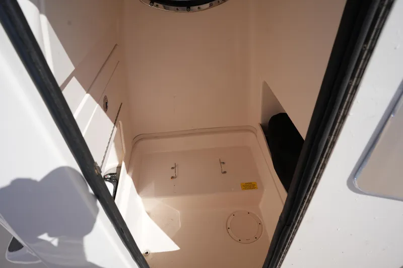 Slide: The Image of 2016 Grady-White 251 Coastal Explorer interior storage compartment. - 28