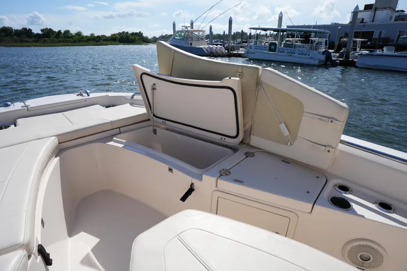 Slide: The Image of 2016 Grady-White 251 Coastal Explorer boat interior with open storage compartment. - 31