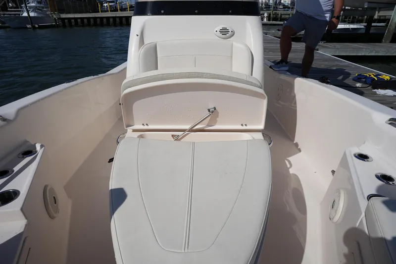 Slide: The Image of 2016 Grady-White 251 Coastal Explorer boat interior with seating and storage. - 33