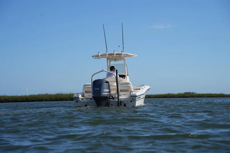 Slide: The Image of 2016 Grady-White 251 Coastal Explorer boat on calm water, rear view. - 5