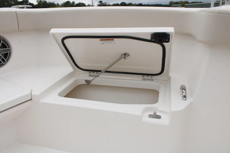 Slide: The Image of 2024 Solace 32 CS boat storage compartment with open hatch. - 13