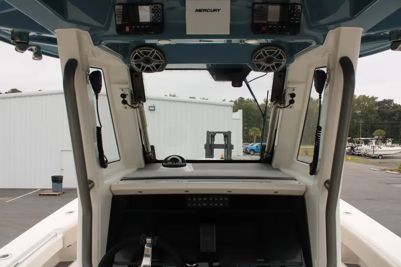 Slide: The Image of 2024 Solace 32 CS boat interior with advanced controls and speakers. - 27
