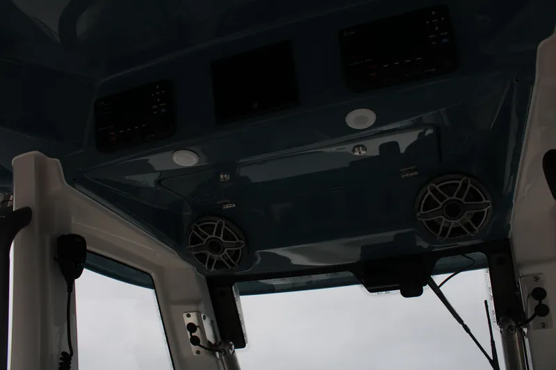 Slide: The Image of 2024 Solace 32 CS boat interior with speakers and control panel. - 32