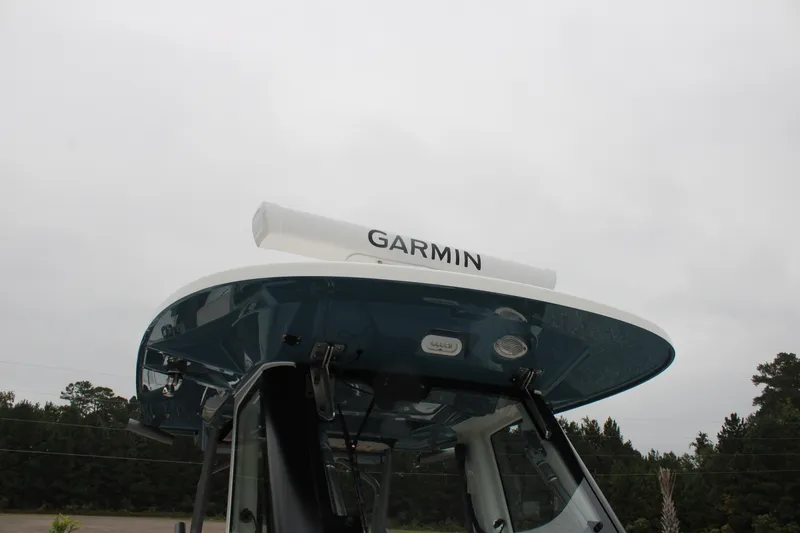 Slide: The Image of 2024 Solace 32 CS boat with Garmin radar on top, overcast sky background. - 34