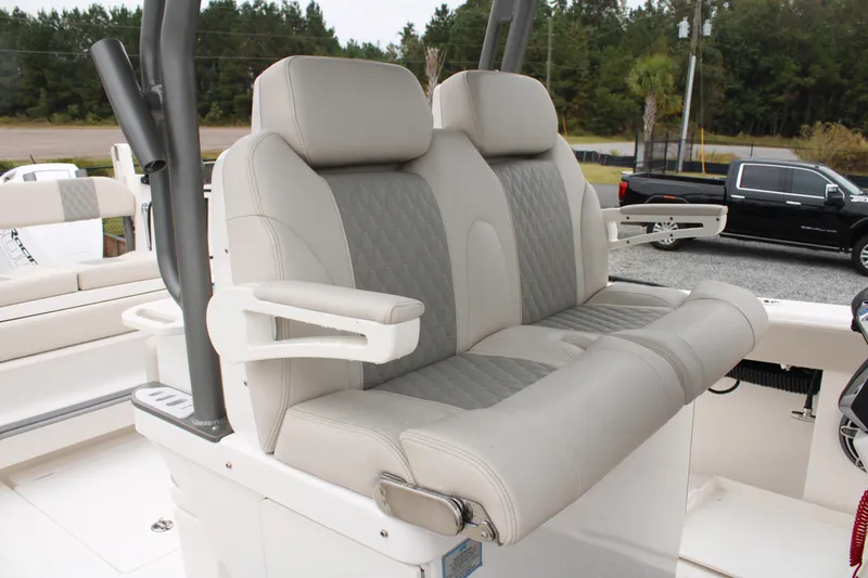 Slide: The Image of 2024 Solace 32 CS boat seats with armrests, featuring elegant gray upholstery. - 35