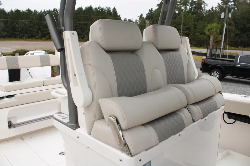 Slide: The Image of 2024 Solace 32 CS boat seats with luxurious gray upholstery and ergonomic design. - 36