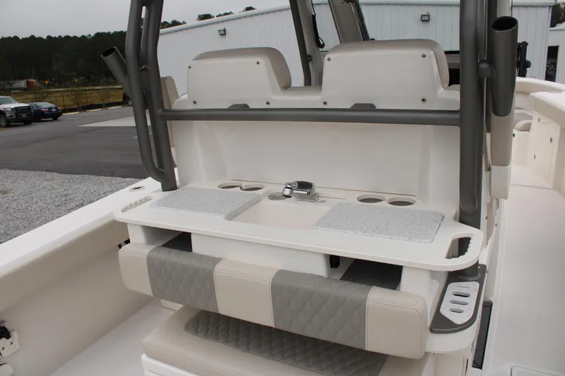 Slide: The Image of 2024 Solace 32 CS boat interior with seating and storage compartments. - 44