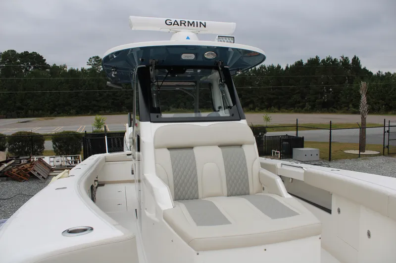 Slide: The Image of 2024 Solace 32 CS boat with Garmin equipment, featuring a sleek design and comfortable seating. - 7