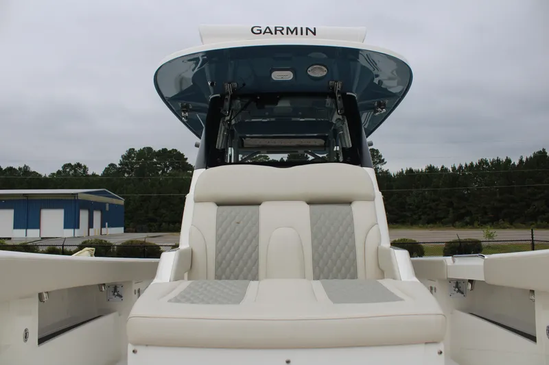Slide: The Image of 2024 Solace 32 CS boat with Garmin equipment, featuring luxurious seating and modern design. - 8