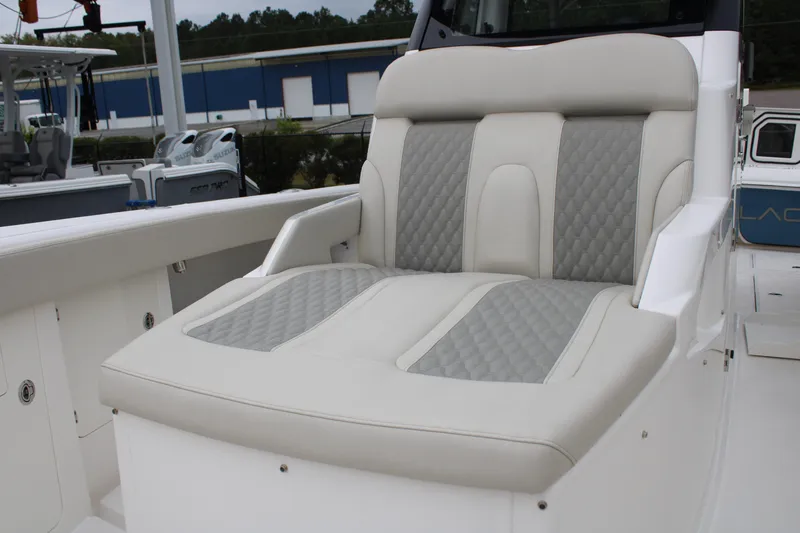 Slide: The Image of Luxurious seating on 2024 Solace 32 CS boat, featuring elegant quilted upholstery. - 9