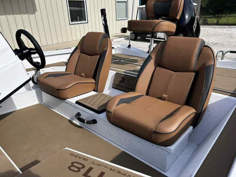 Slide: The Image of 2025 Xpress H18B boat interior with brown leather seats and modern design. - 13