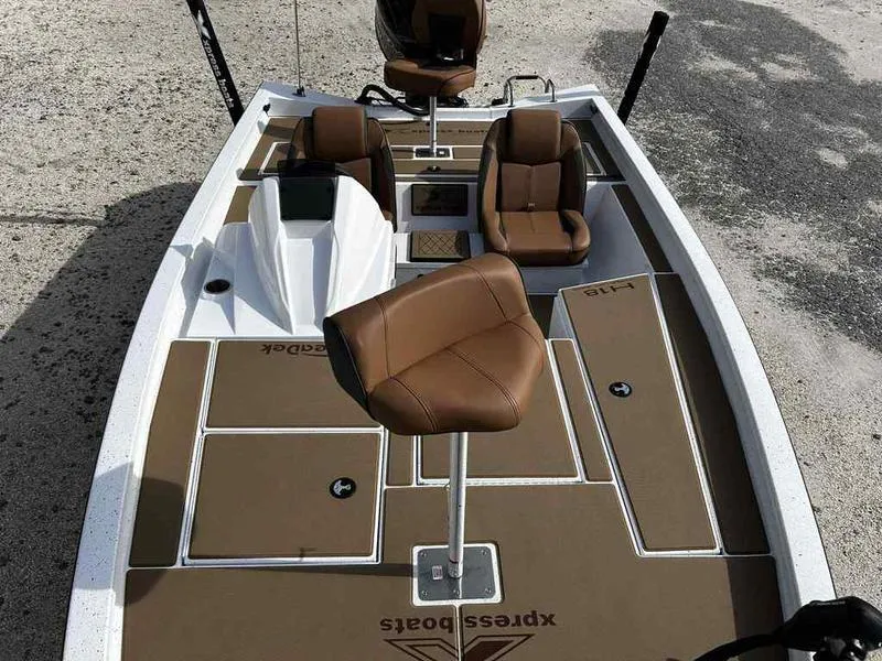 Slide: The Image of 2025 Xpress H18B boat with brown seating and deck, designed for fishing and leisure activities. - 18