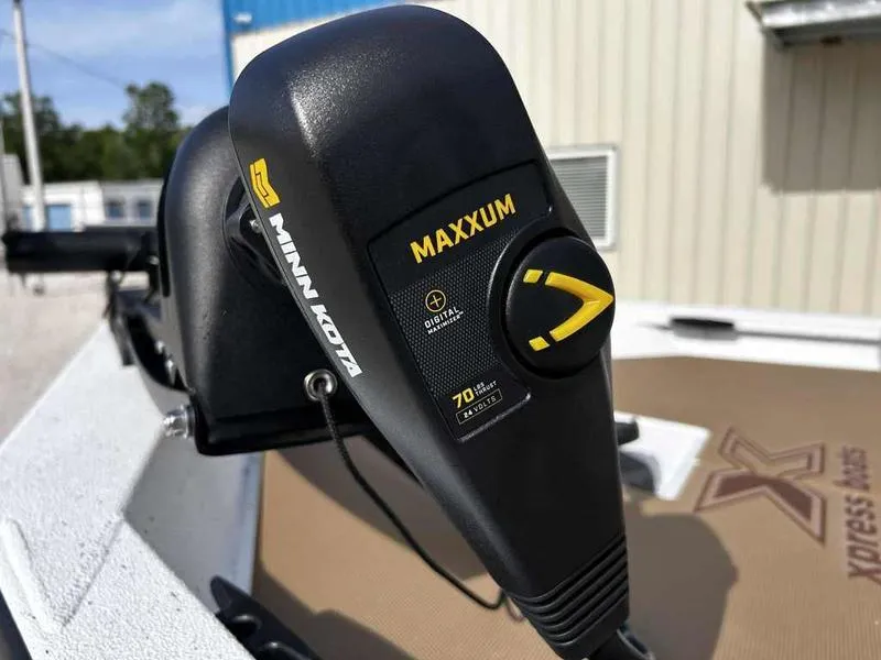 Slide: The Image of Minn Kota Maxxum motor on 2025 Xpress H18B boat, close-up view. - 23